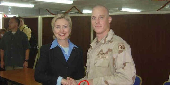 Is This Soldier Covertly Showing He Was Coerced into Shaking Hands With Hillary Clinton?