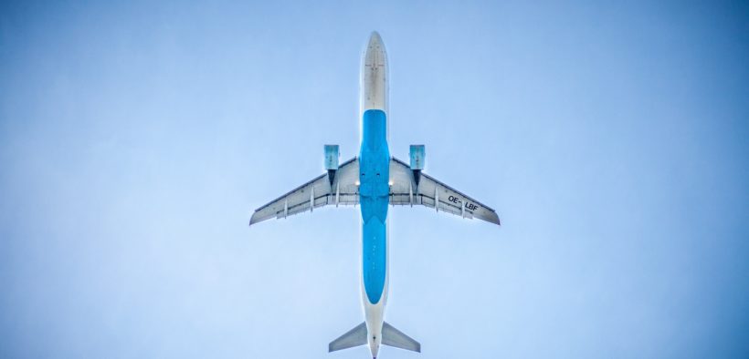 A plane in the air from below.