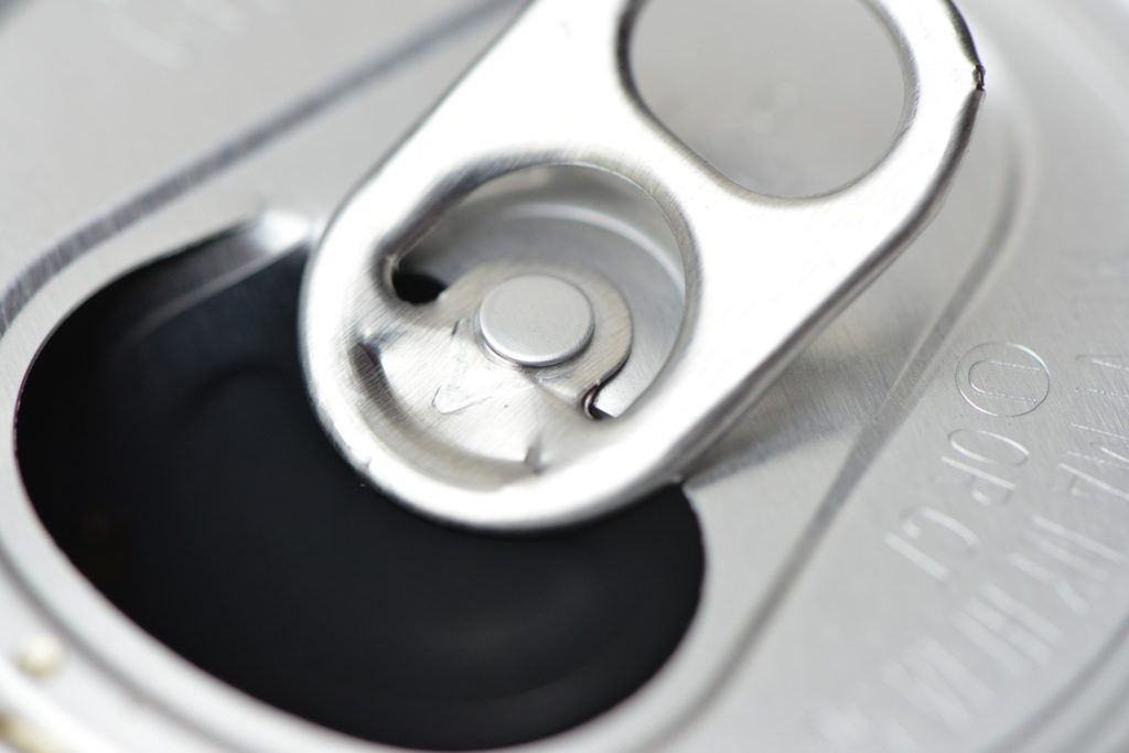 Close-up of the top of a can of soda.
