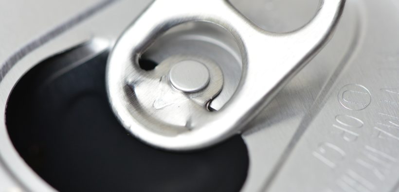 Close-up of the top of a can of soda.
