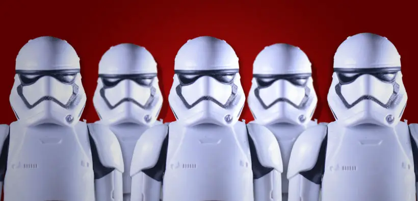 Star Wars stormtroopers against a dark red background.