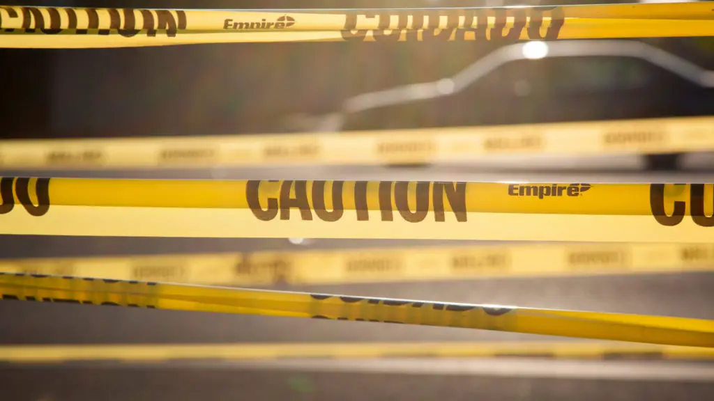 Yellow tape bearing the word "CAUTION."