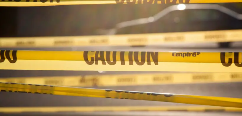 Yellow tape bearing the word "CAUTION."