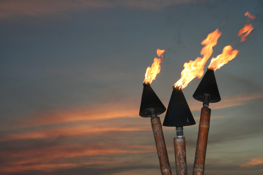 Tiki torches at sunset.