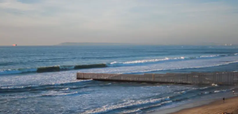 The U.S.-Mexico border wall in Playas, Tijuana, where it extends out into the Pacific Ocean.