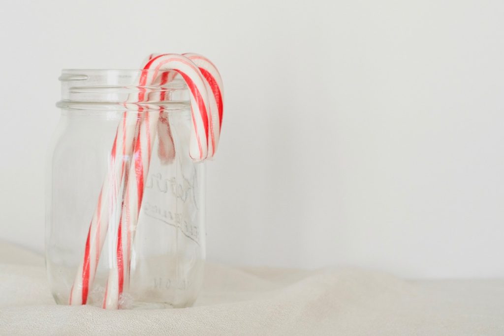 Candy canes in a jar.