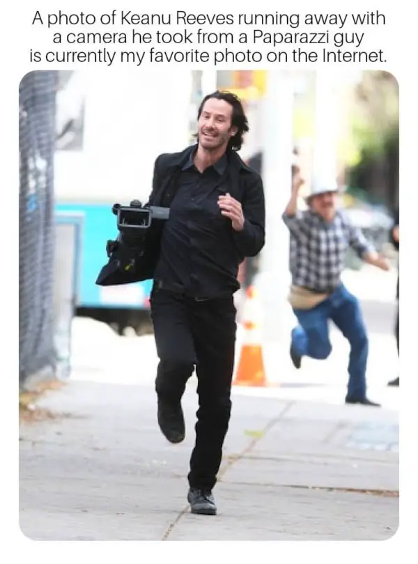 keanu reeves holding shirt